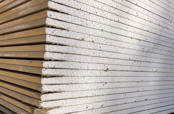 Piled sheets of drywall